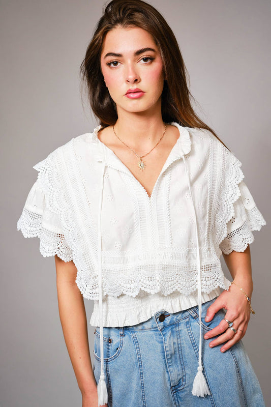 Eyelet Embroidered Tassel Tie Front Crop Top