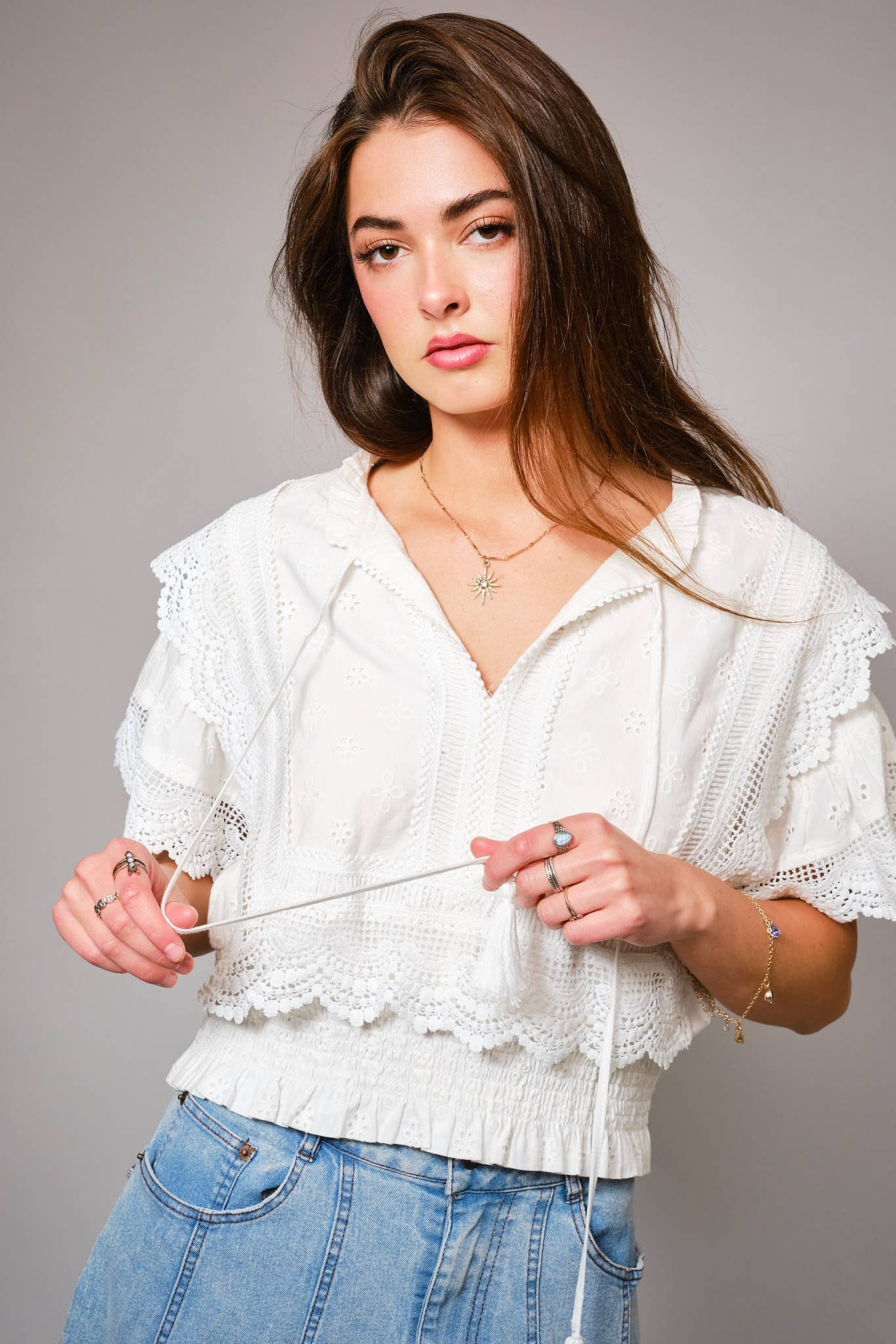Eyelet Embroidered Tassel Tie Front Crop Top