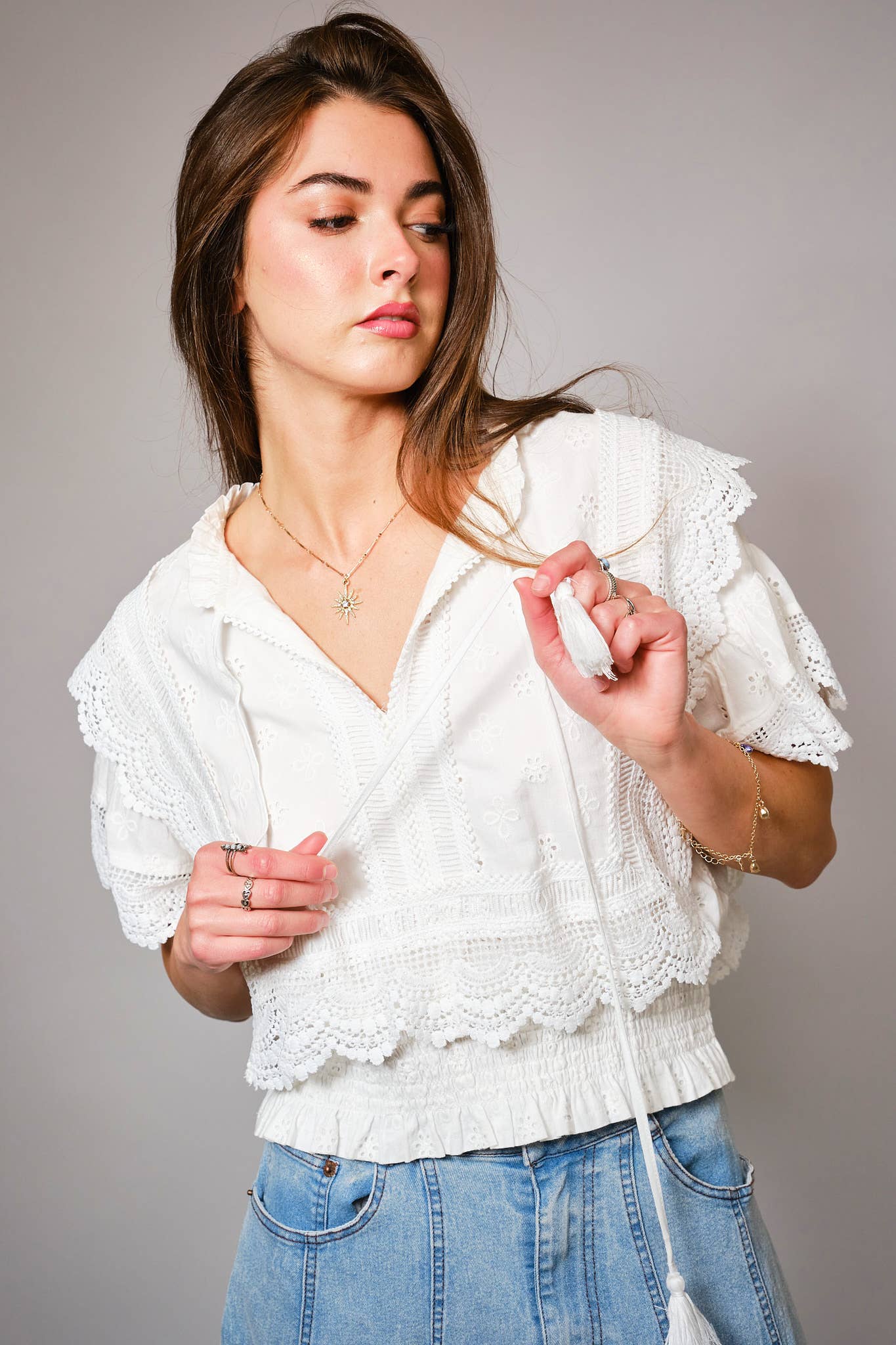 Eyelet Embroidered Tassel Tie Front Crop Top