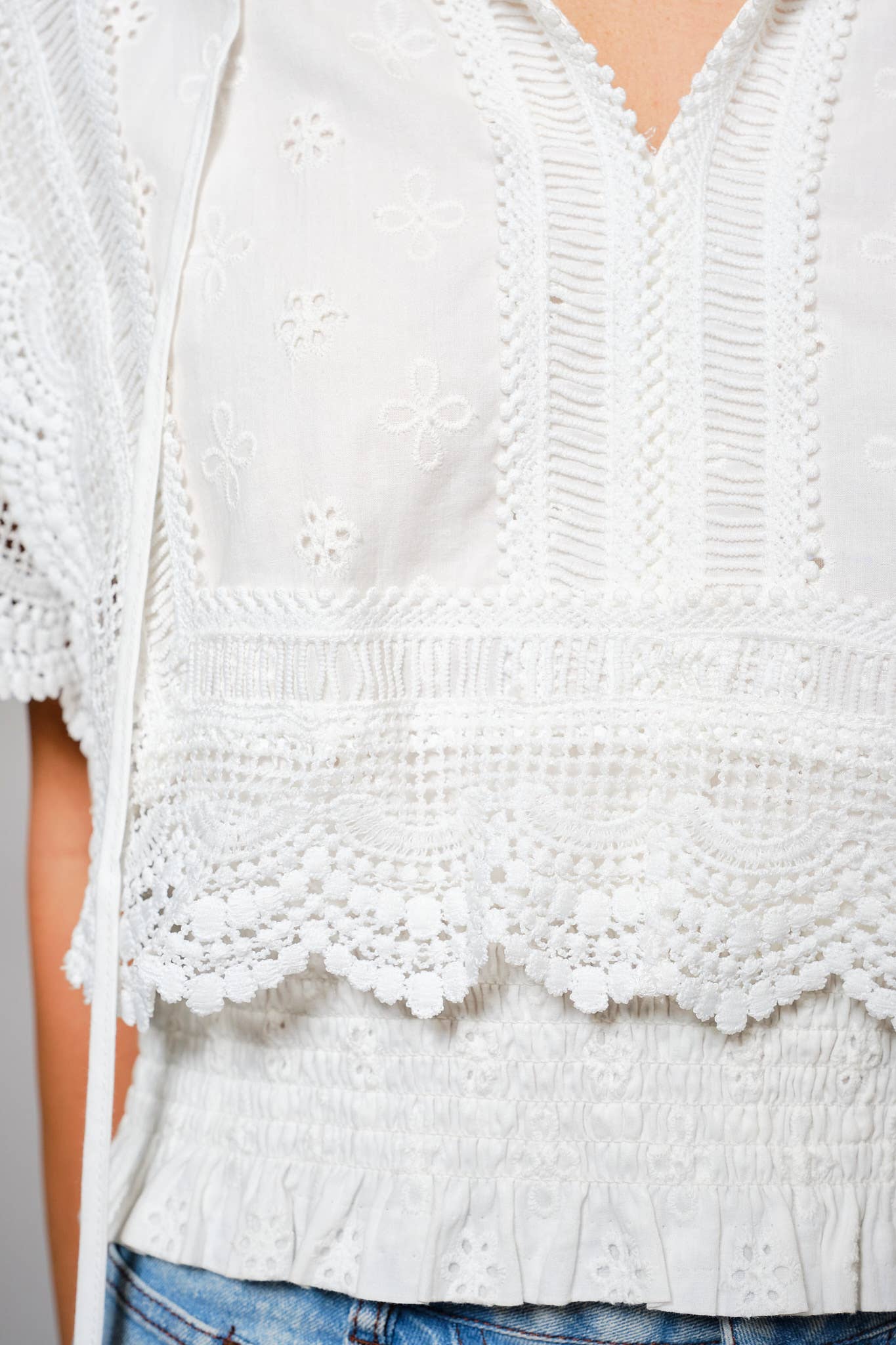 Eyelet Embroidered Tassel Tie Front Crop Top